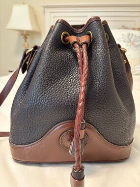 Dooney & Bourke Black Pebbled Leather Drawstring Bucket Bag with Brown Trim